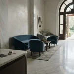 An elegant marble lounge with a discreet cashier counter and a phone beside an unmarked payment card
